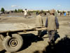 Two Men Pulling a Cart